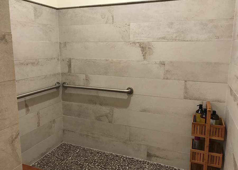 Custom plank-style tile work in The Dailey Method’s new showers